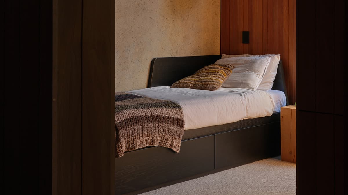 View of the guest bedroom showcasing dark ceilings 