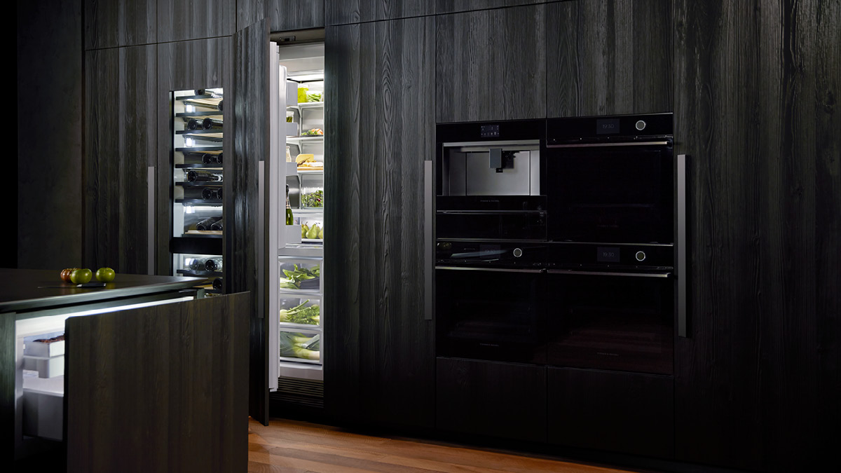 Integrated wine cabinet, refrigerator, cooldrawer and wall ovens.