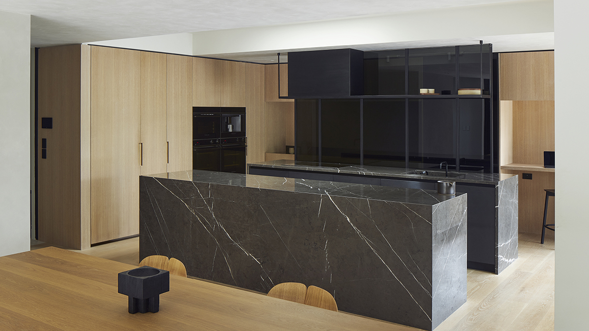 designer kitchen with black marble surfaces overlooking Fisher & Paykel's Integrated and Minimalist appliances