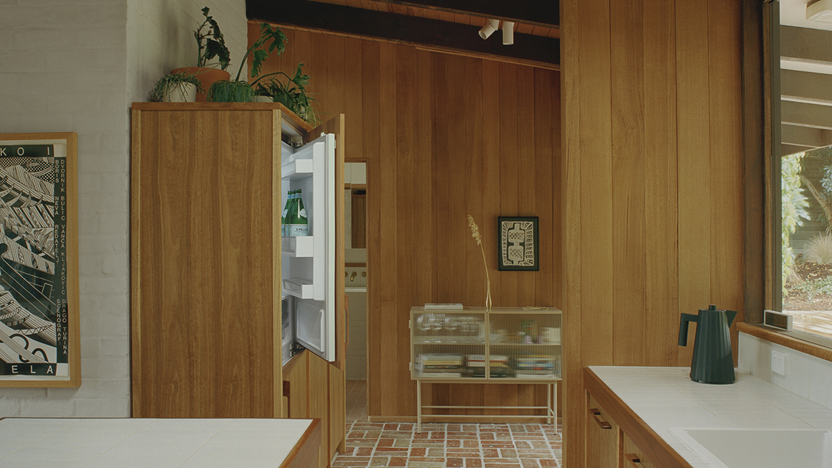 Interior shot of a kitchen featuring a Fisher & Paykel integrated refrigerator