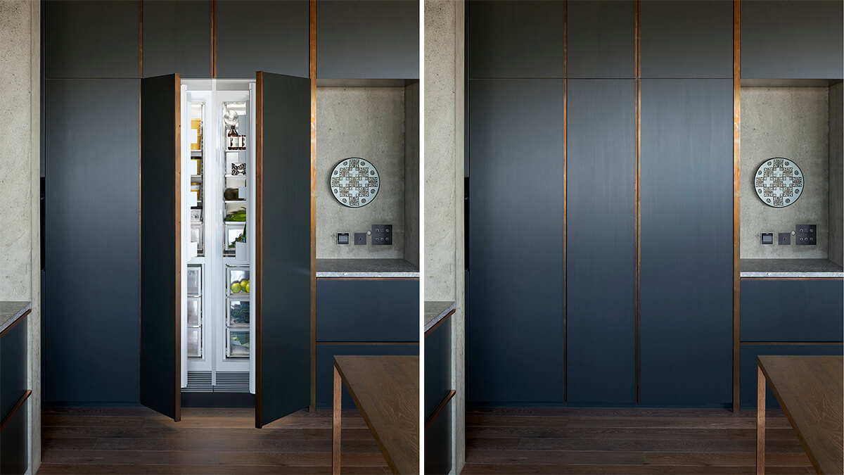 Column refrigeration integrated into a bold blue feature wall.