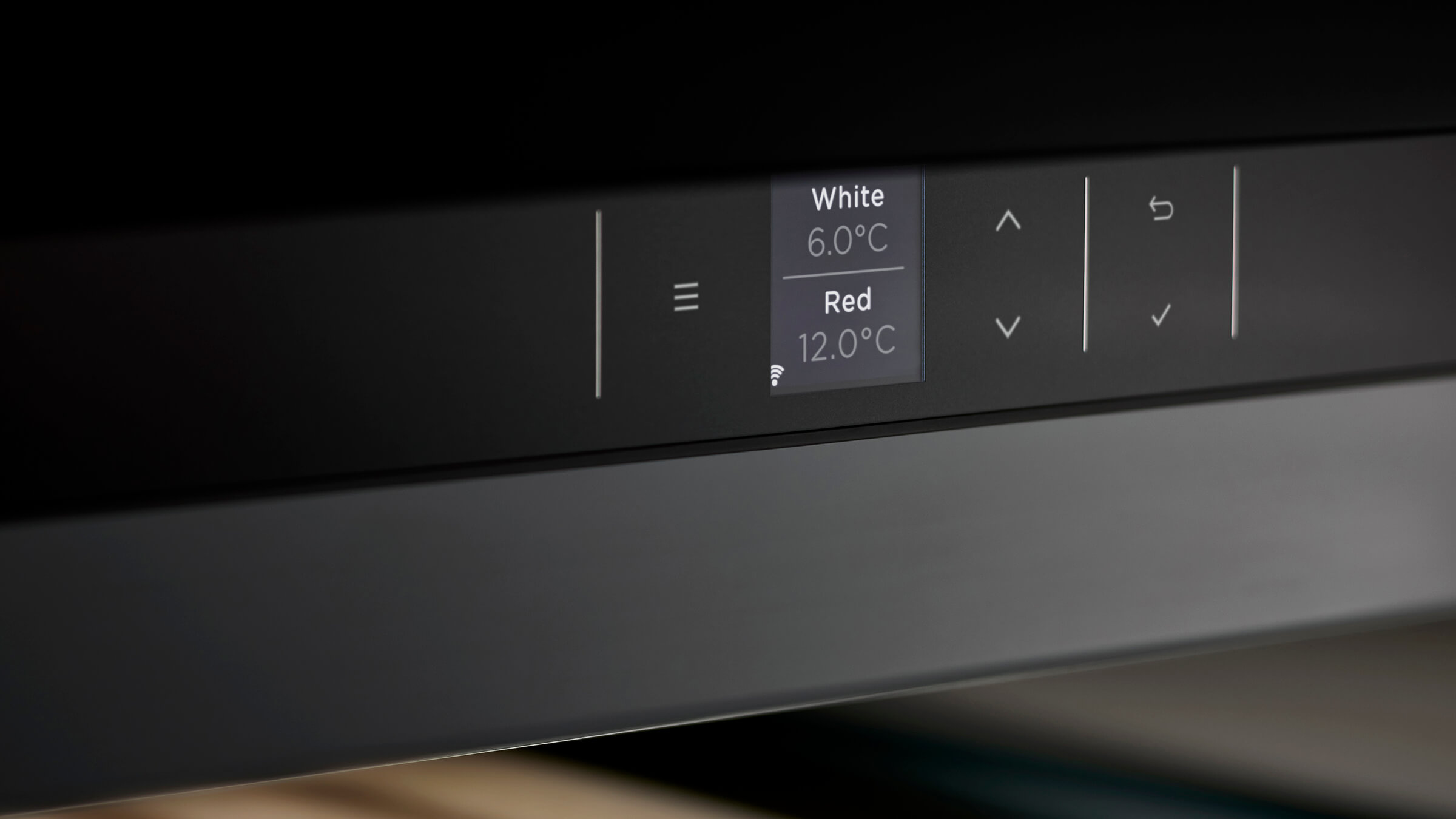 Close-up of the dual temperature control panel for independent wine climate zones