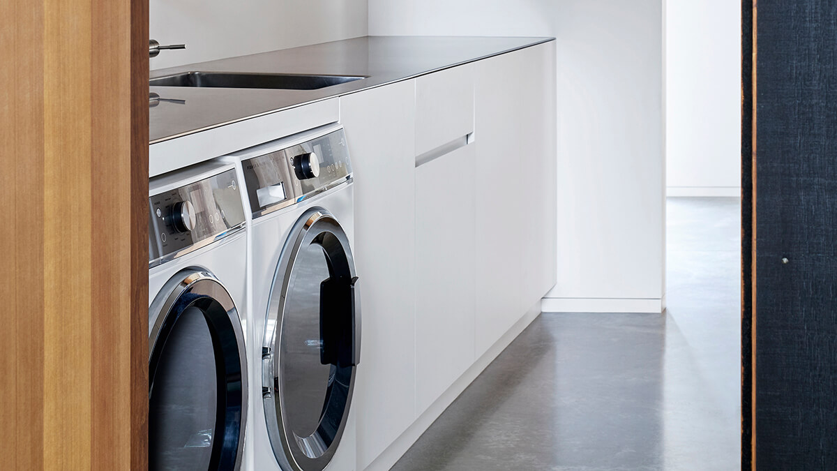 Laundry showing front loader washer and dryer side by side