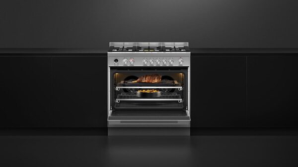 Conventional and Steam Ovens in black with silver detailing set into black cabinetry.