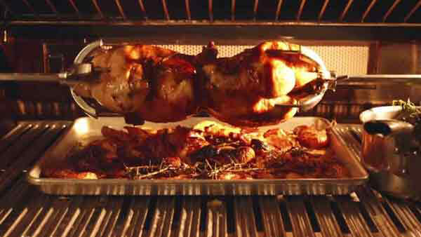 Butter and Rosemary Brushed Rotisserie Chicken in Oven