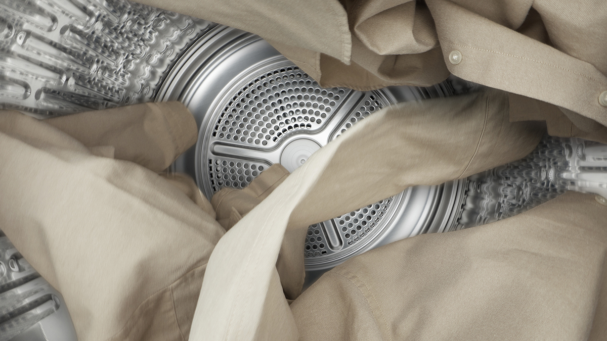 Dryer drum with garments in motion