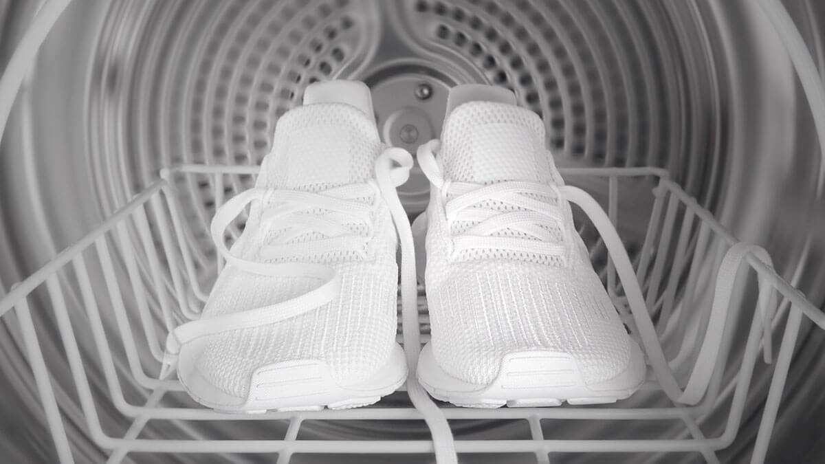 Interior of a Dryer with Pristine White Sneakers atop a Drying Rack.