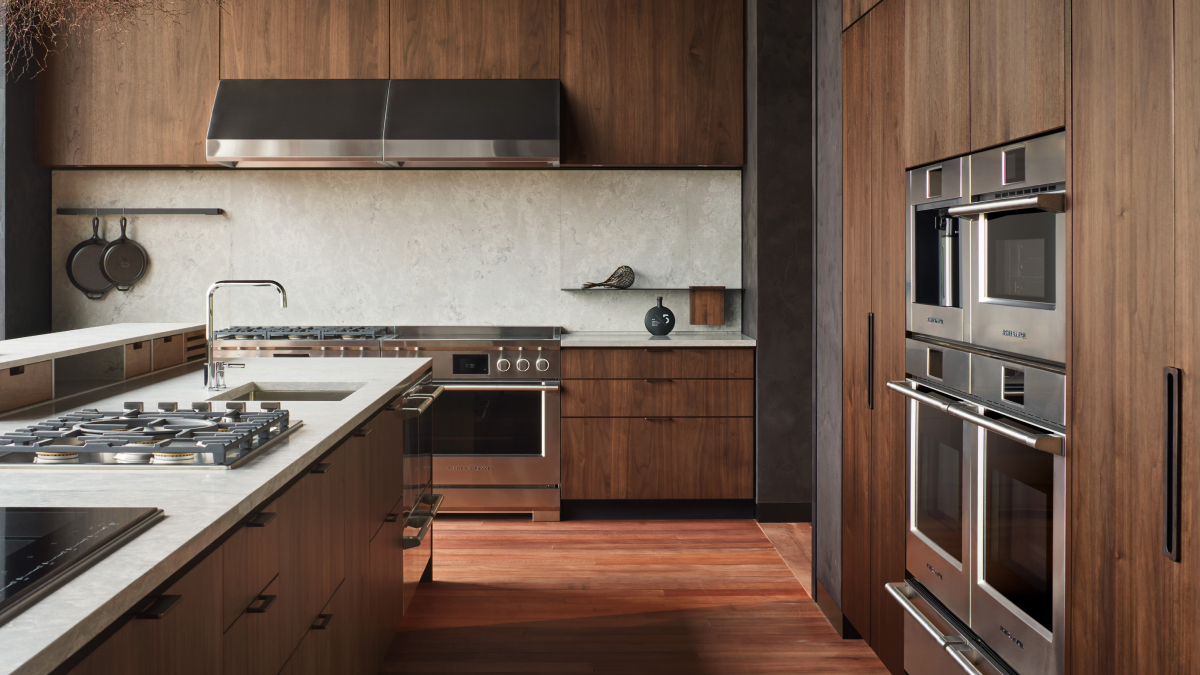 Wood panel Kitchen showing a range of Fisher & Paykel appliances