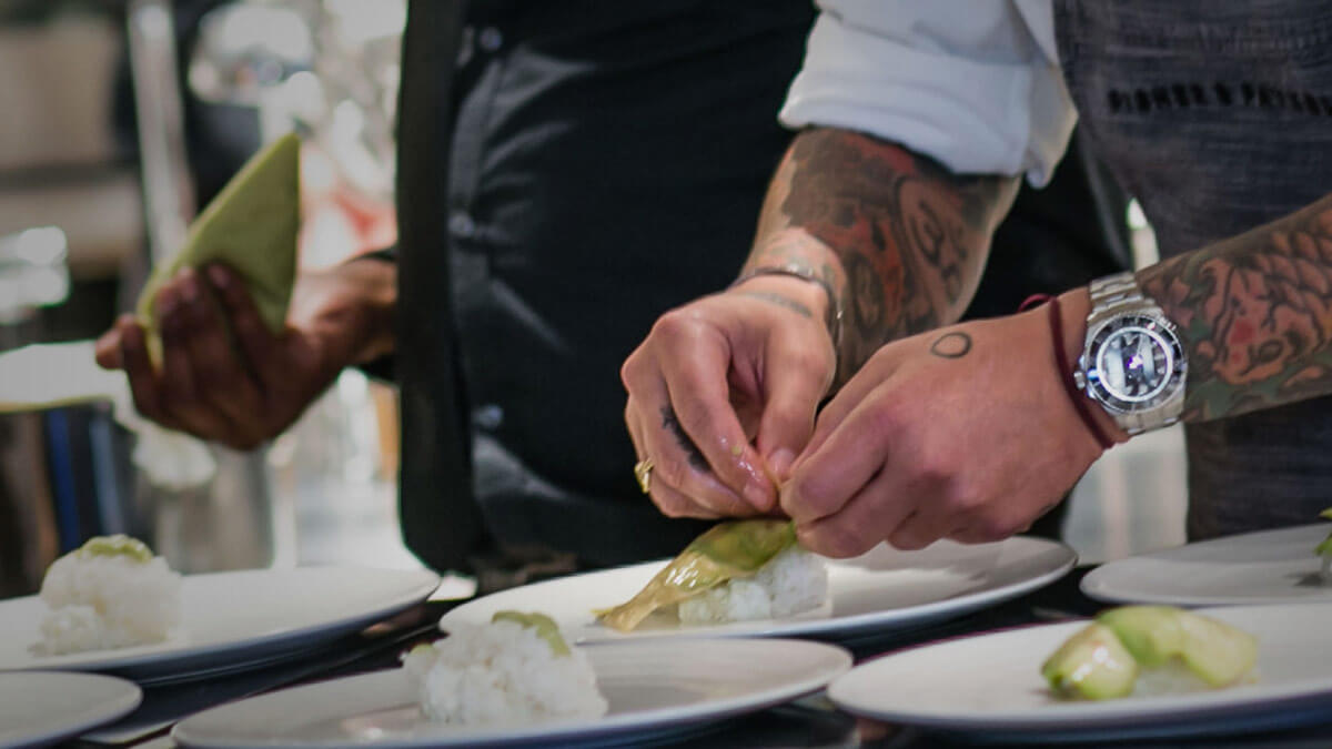 Chef Ludo Preparing Multiple Gourmet Dishes at a Restaurant.