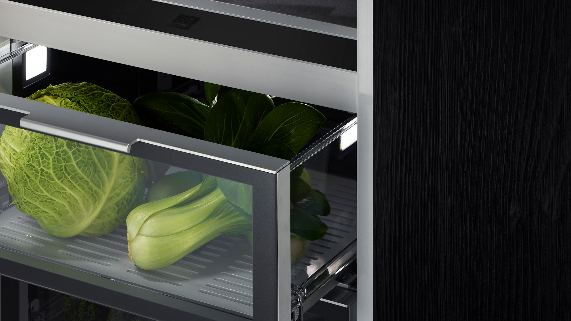 A well-organized refrigerator interior showing energy-efficient LED lighting