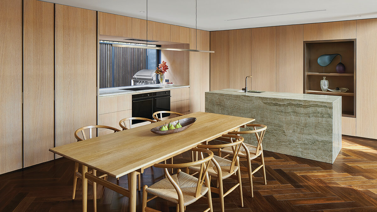 Side angle photo of Herne Bay Townhouses' open floor plan kitchen and dining.