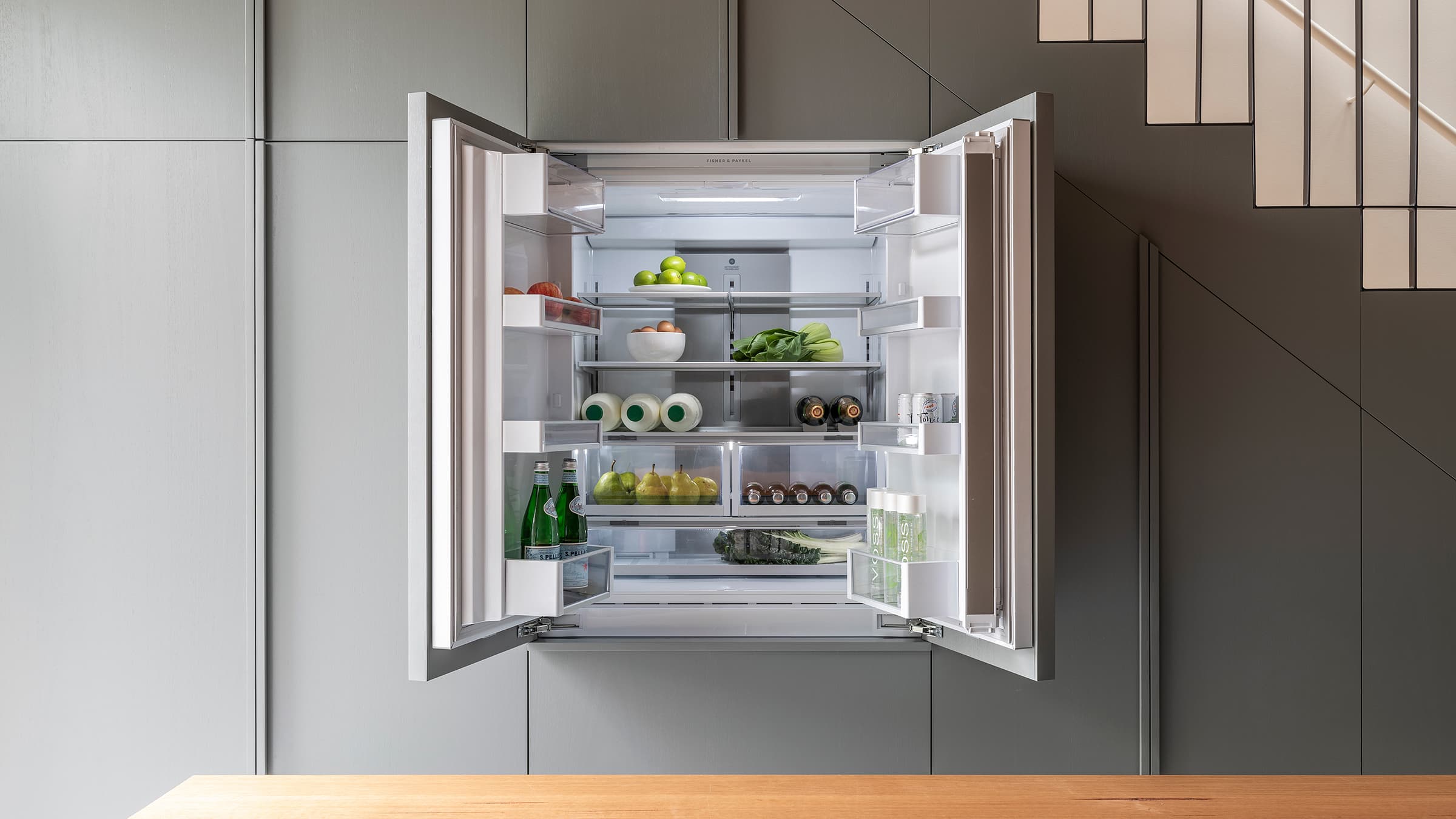 View of refrigerator with doors open