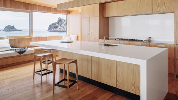 Hahei House's Scandinavian-Style Oak Kitchen with Coastal Facing Windows.