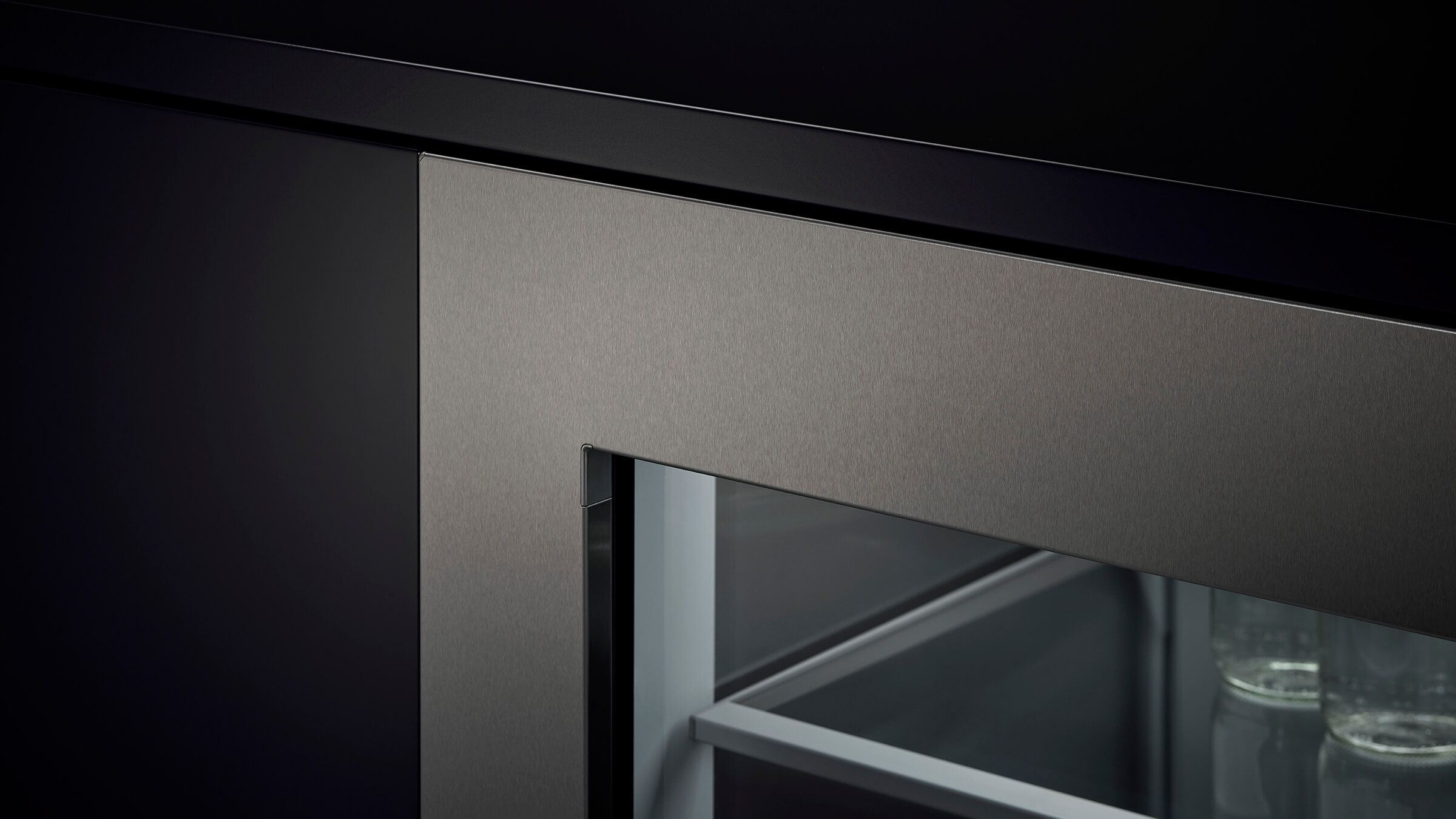 Detail of the flush cabinetry installation of an integrated wine column