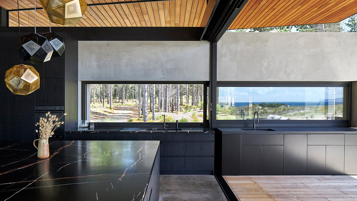 Inside kitchen looking towards benches and outside