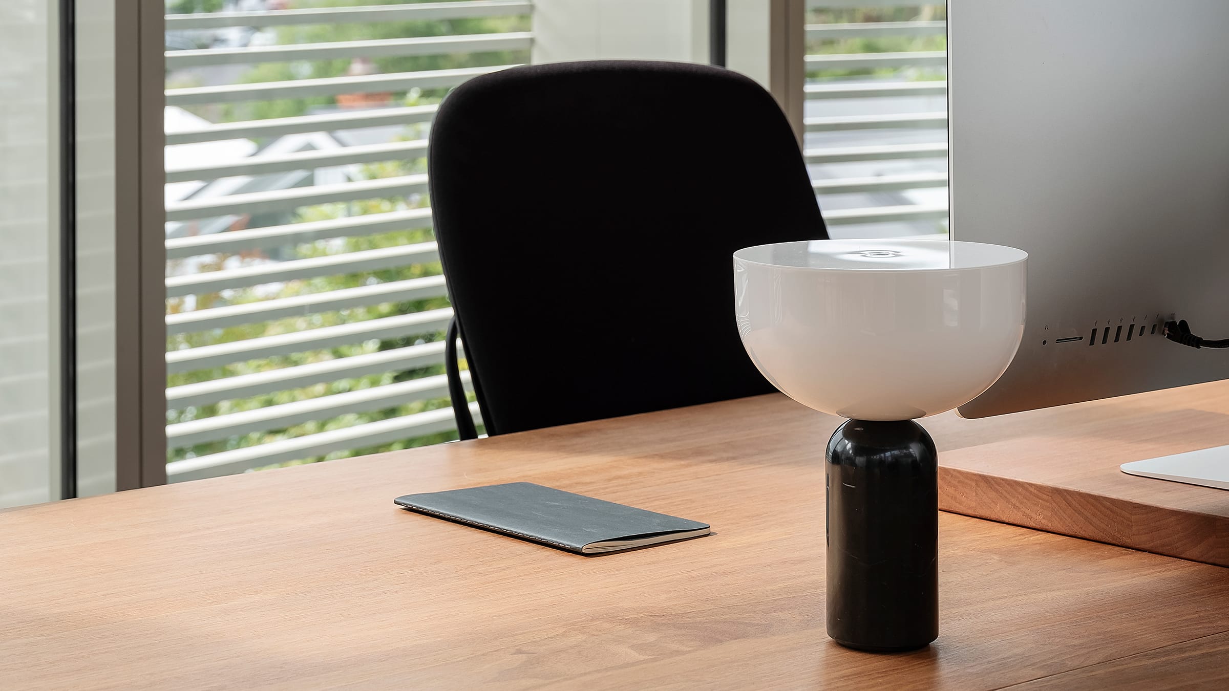Office desk space with window behind