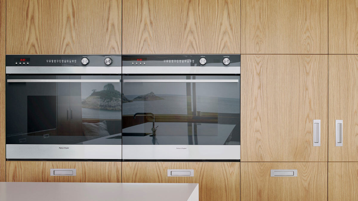 Two Built-in Ovens Seamlessly Blending Into Wooden Cabinetry.