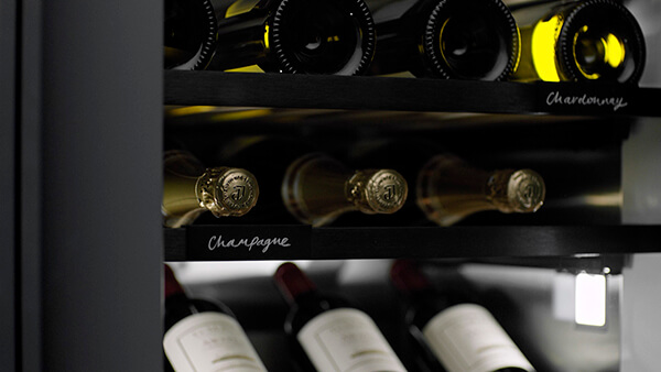 Close Up of Wine Bottles on Wine Cabinet Shelves