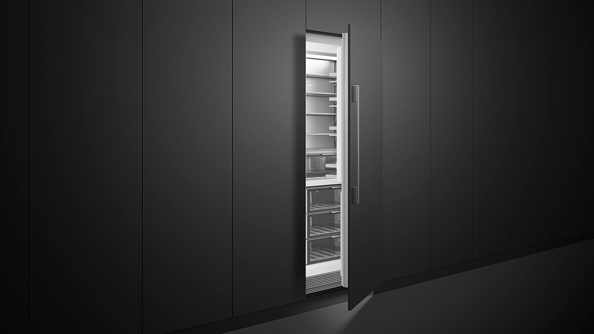 Integrated vertical refrigerator in a warm, wood-finished kitchen scullery