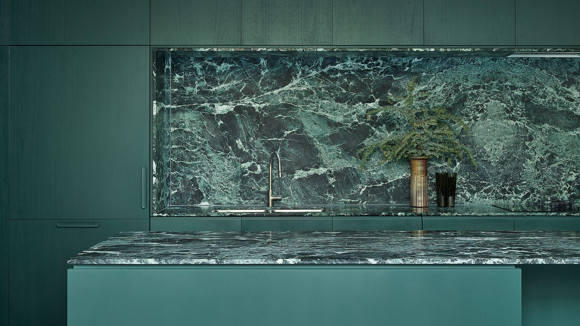 Shot of the green-marble kitchen.