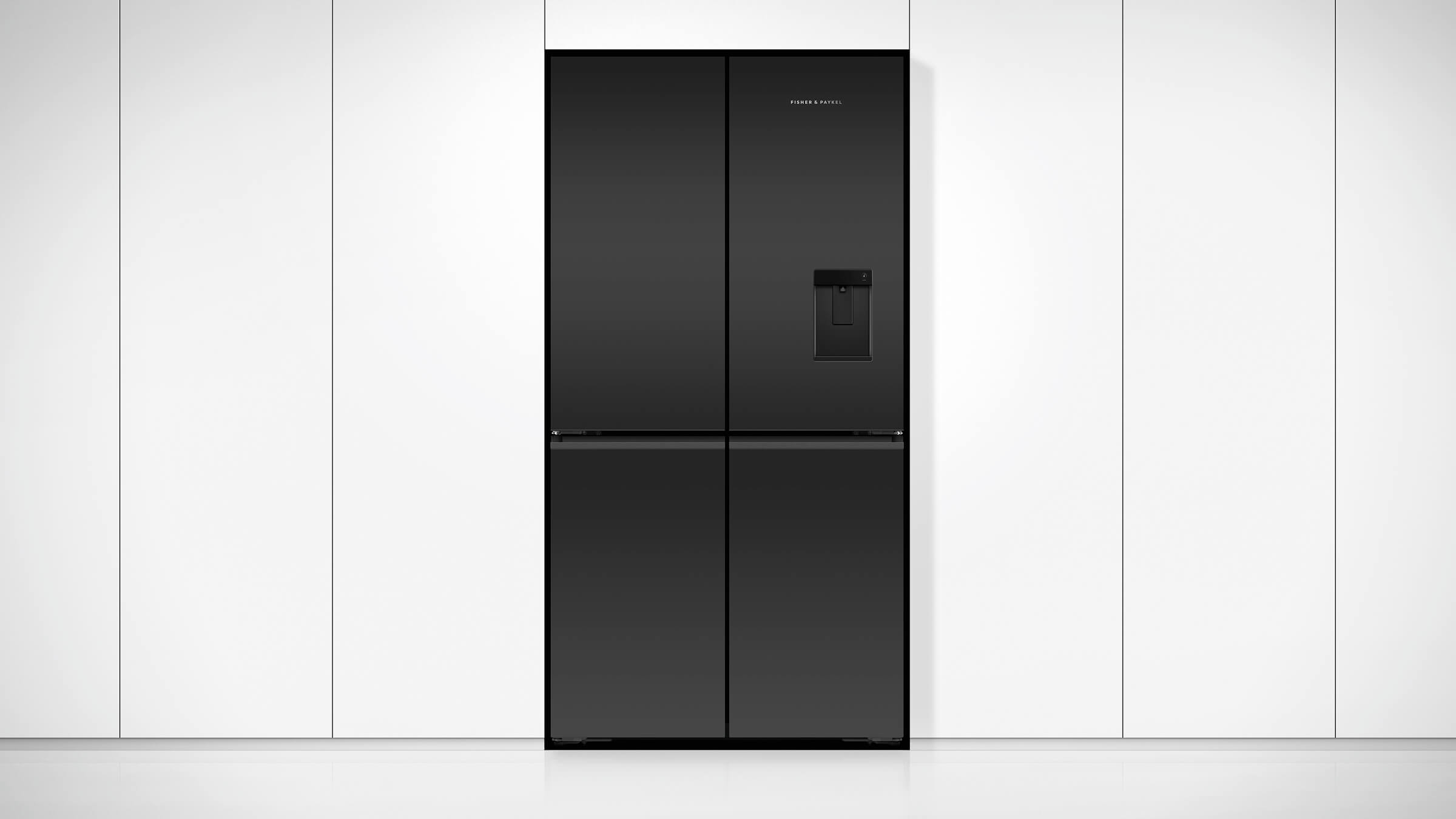 A minimal black stainless steel Quad Door refrigerator within sleek kitchen cabinetry