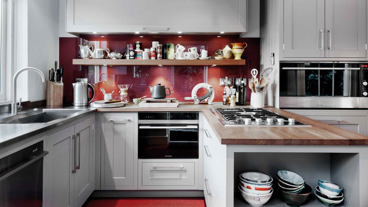 Side View of Peter Gordon's Kitchen at Victorian terrace house with Fisher & Paykel gas cooktop and appliances.