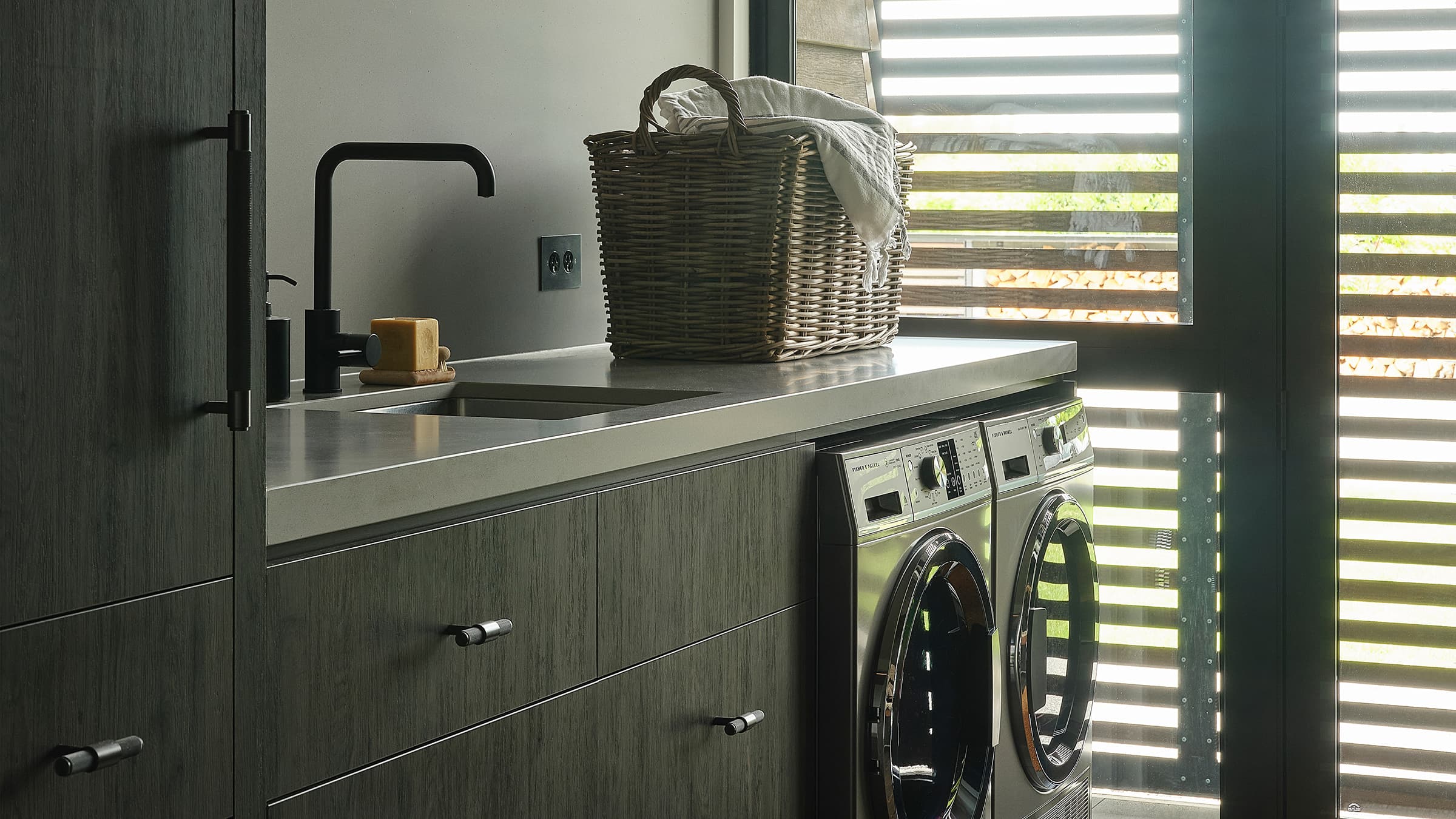 Shot of the laundry showcasing the Fisher & Paykel Washer Dryers 