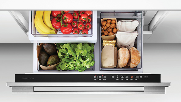 Top view of a refrigerator drawer with fruits, vegetables and bread.