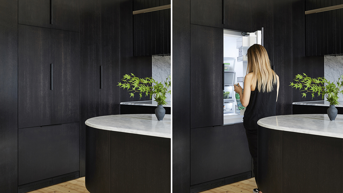 Dark timber hides an integrated refrigerator.