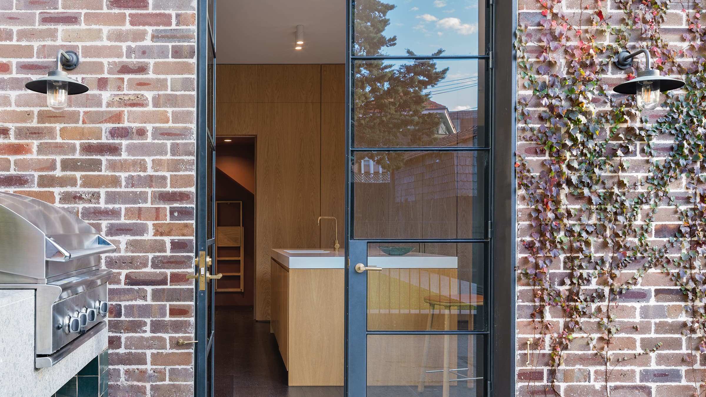 Close up of the integrated refrigerator and freezer. The refrigerator door is ajar.