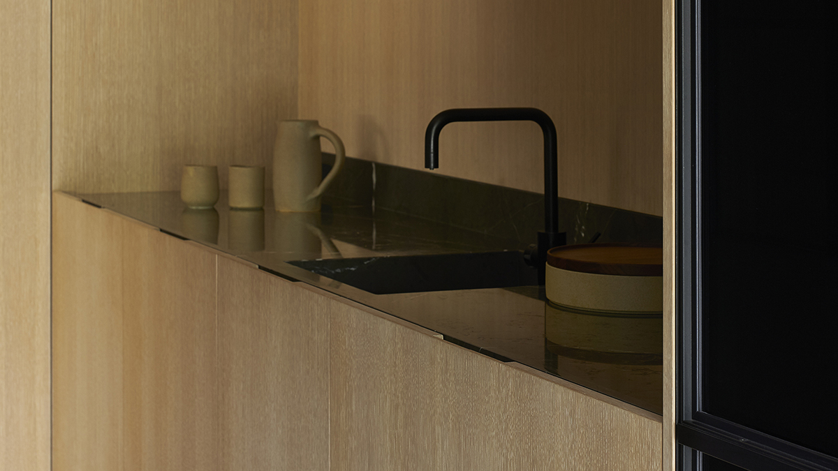 close up of the kitchen sink bench showing a minimal sink fixture