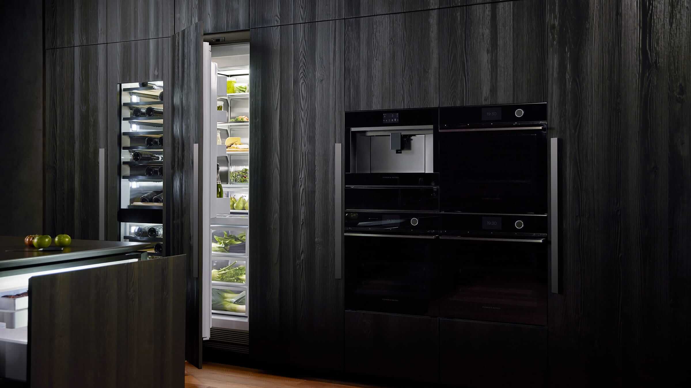 Minimalist kitchen featuring seamlessly integrated vertical refrigeration columns