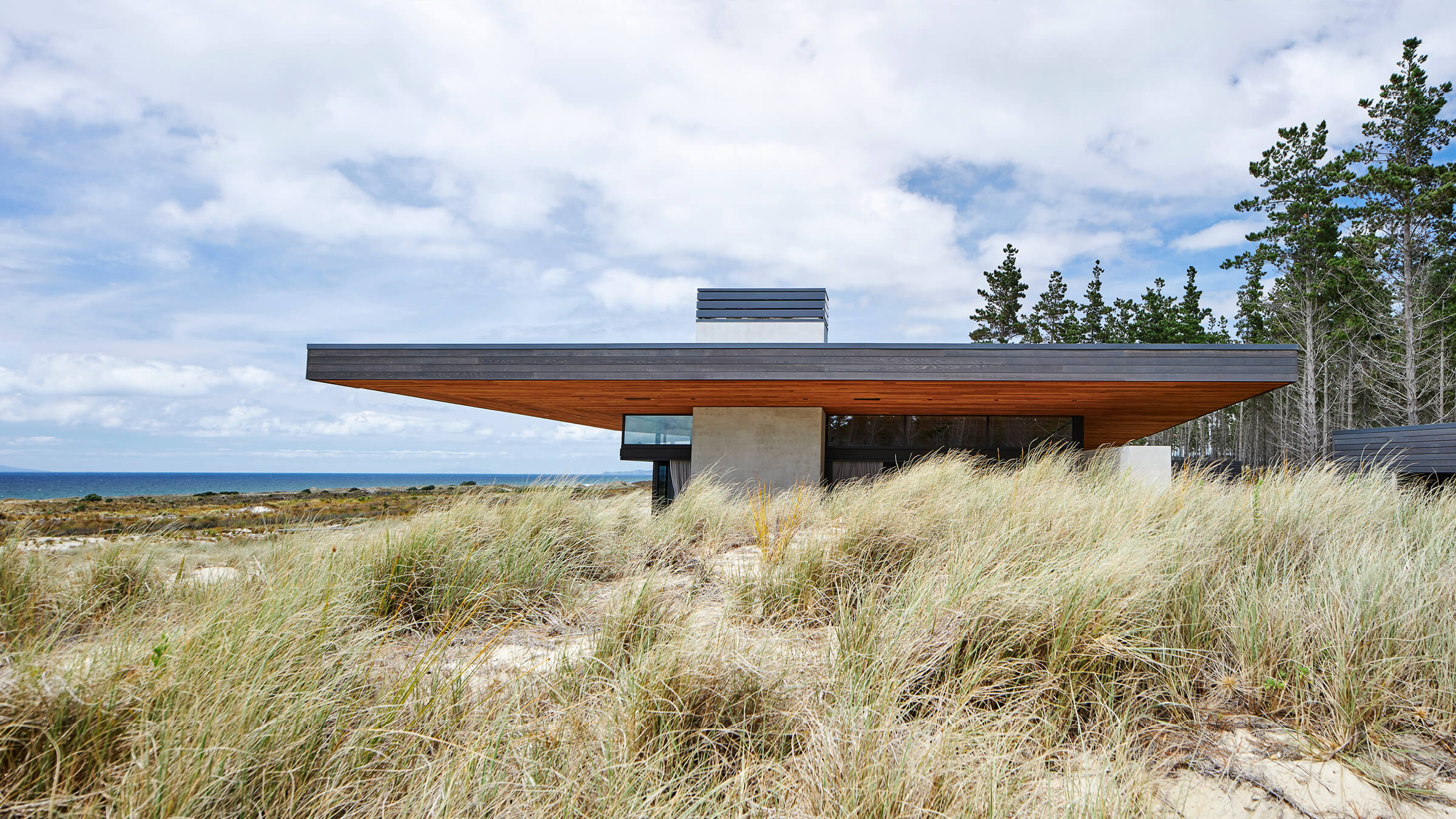 Side view of Sandiland house amongst the sand dunes