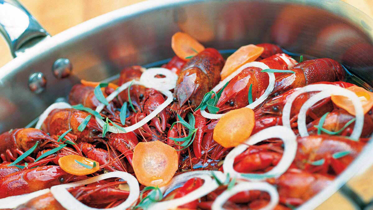 Close-up of Cassoulette of Crayfish a La Nageon on a pan.