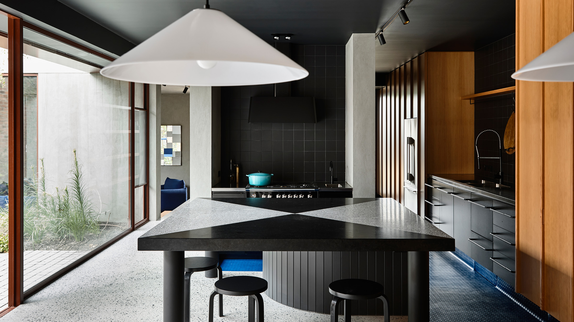 Full shot of the Oak House Kitchen and the floor to ceiling glass windows it faces.