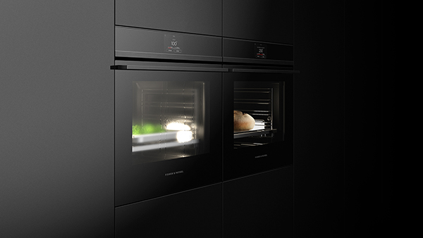 Combination of a Conventional and Steam Oven in Black with Silver Detailing Set into Black Cabinetry.