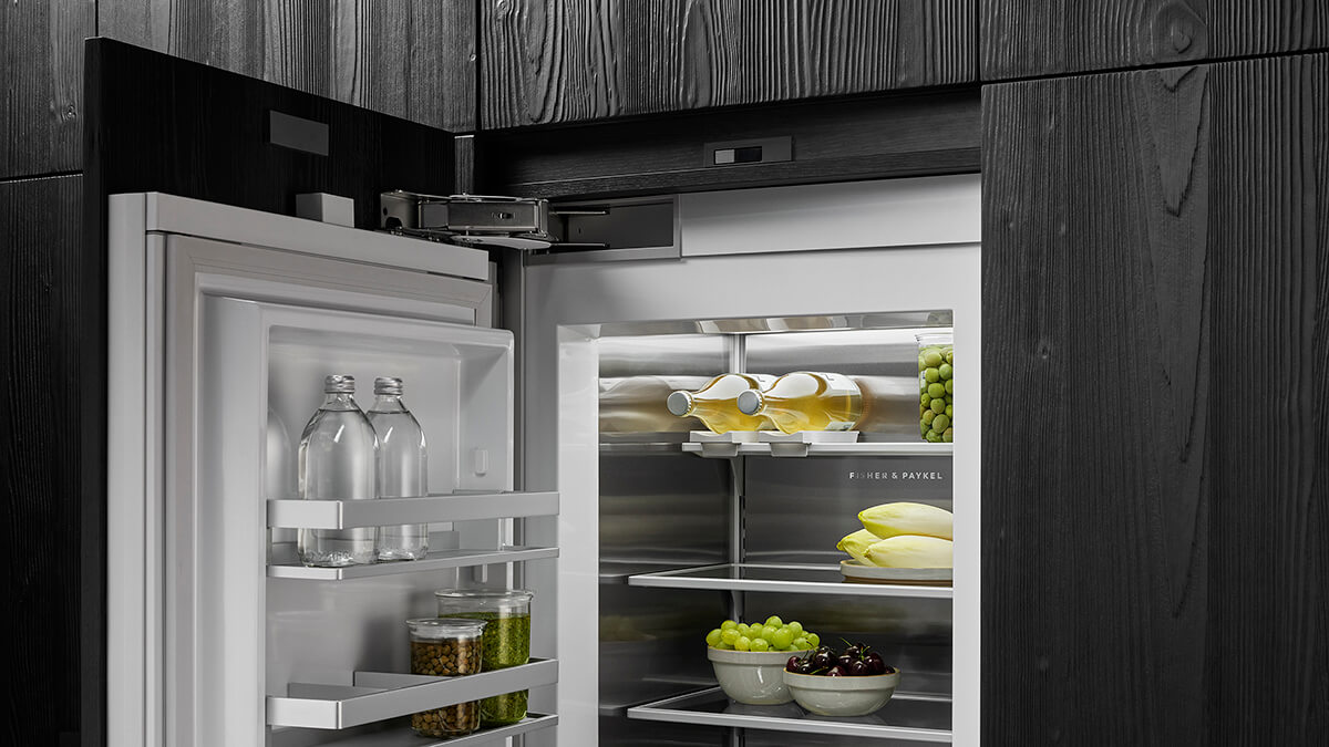 Premium white interior with glass shelves of an empty refrigerator column
