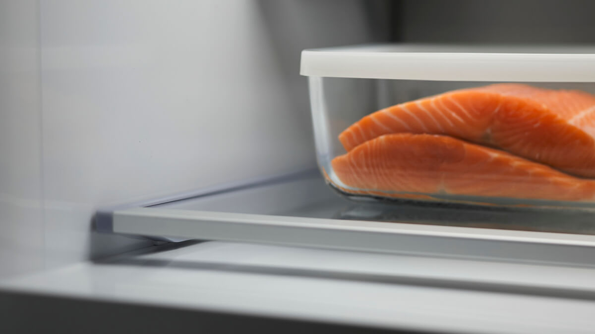 Fresh leaf greens like kale and bok choy in a dedicated produce drawer