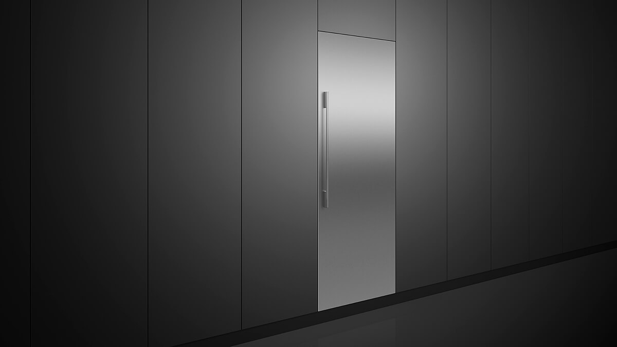 A stainless steel refrigerator column built into dark vertical cabinetry