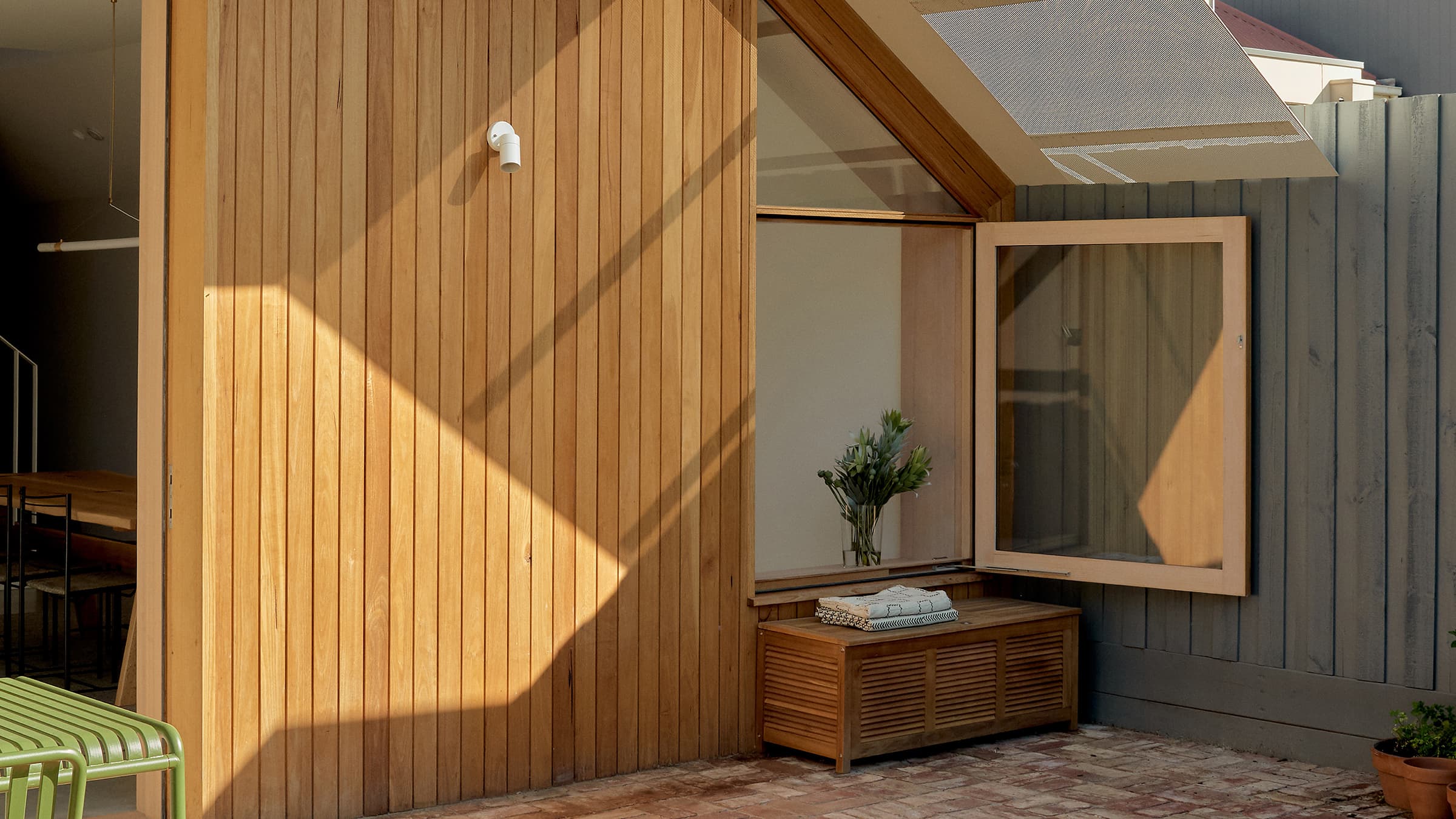 View of the hallway storage with the door ajar.