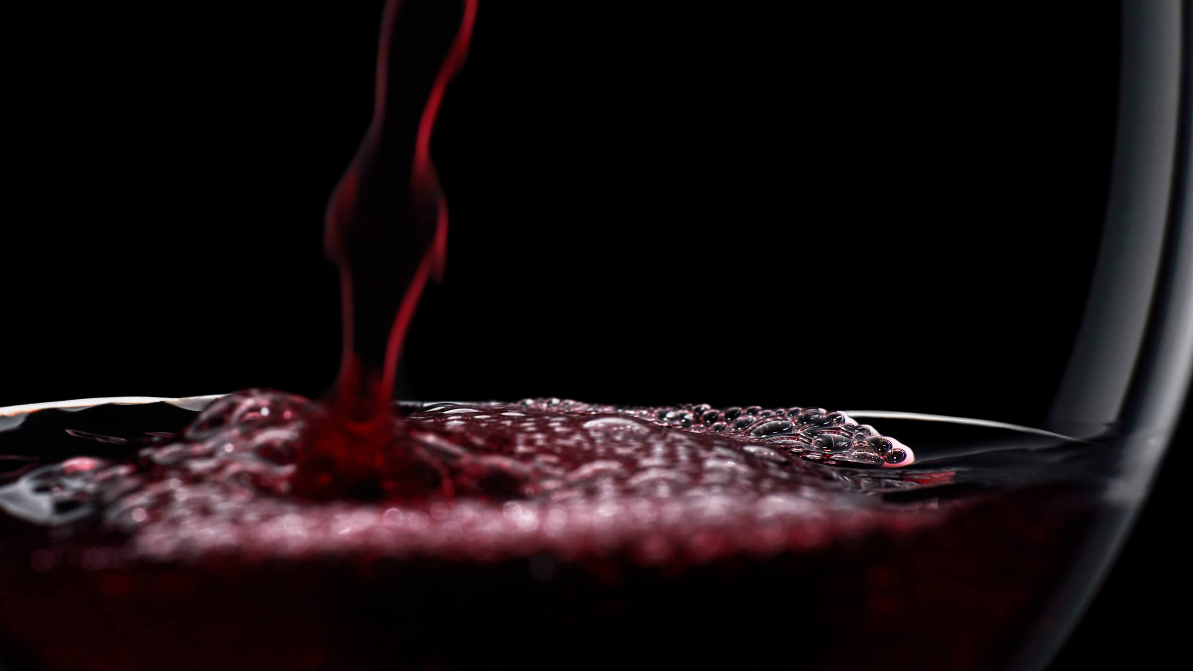 Red wine being poured, highlighting cellar mode storage