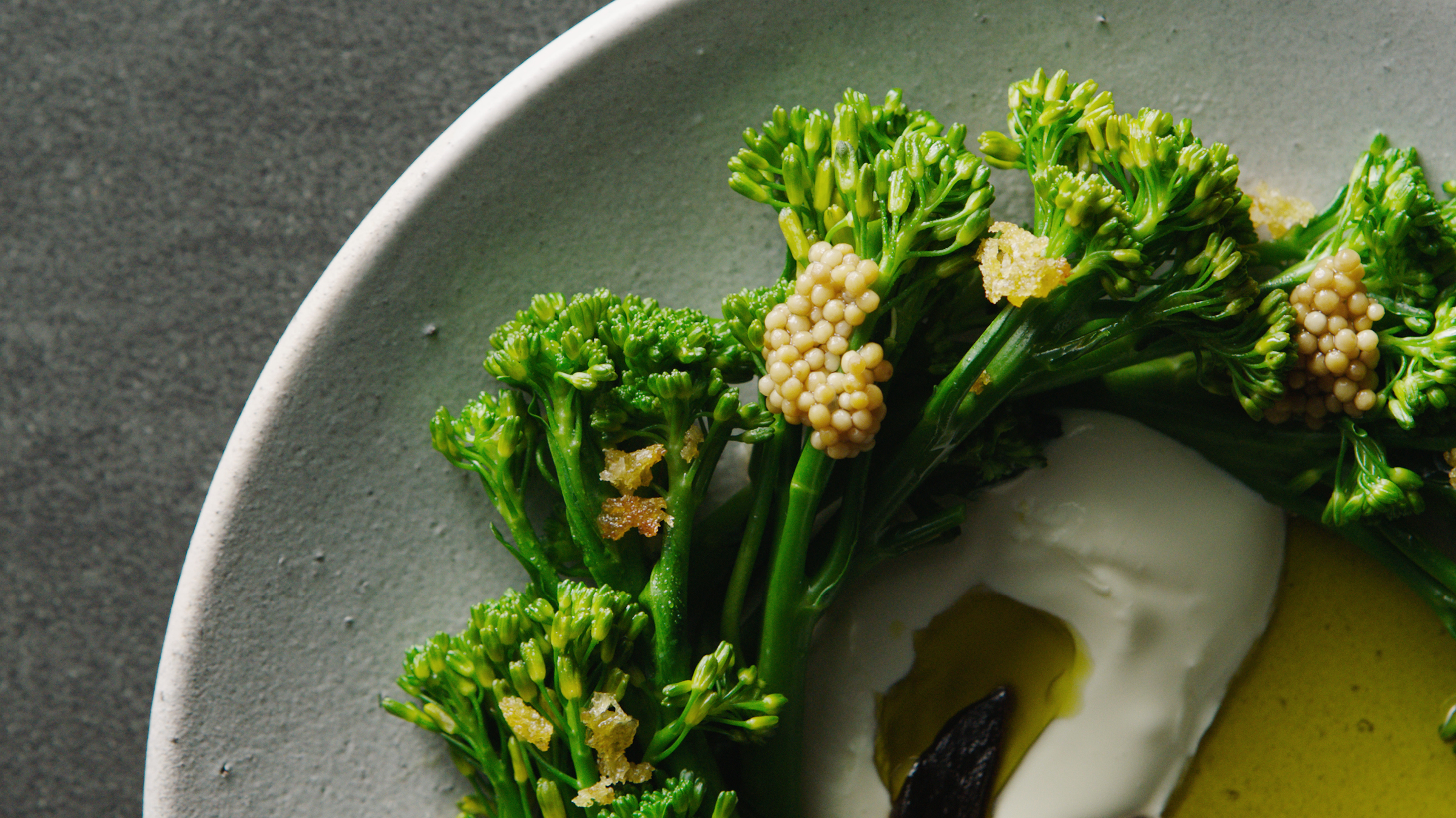 A close up of plated broccolini