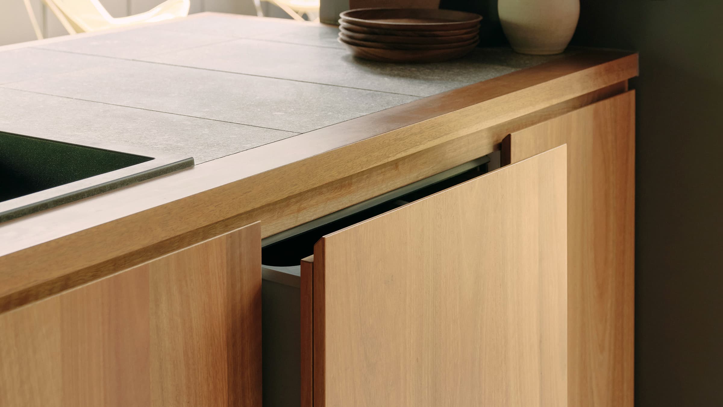 Shot of the kitchen-dining area, showcasing the minimal kitchen design and colour palette 