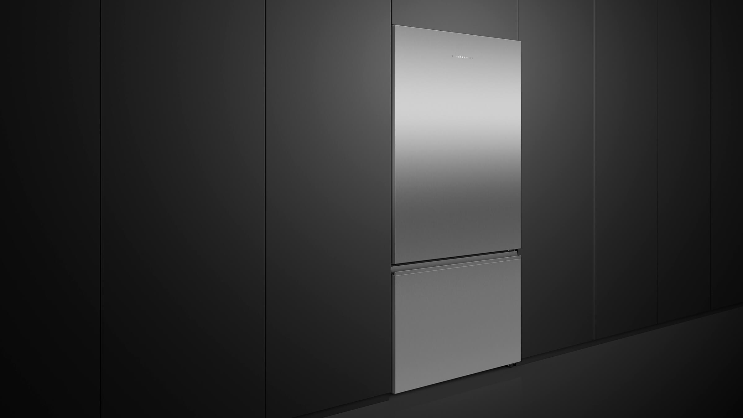 Elegant stainless steel bottom freezer refrigerator integrated into a light-colored kitchen design